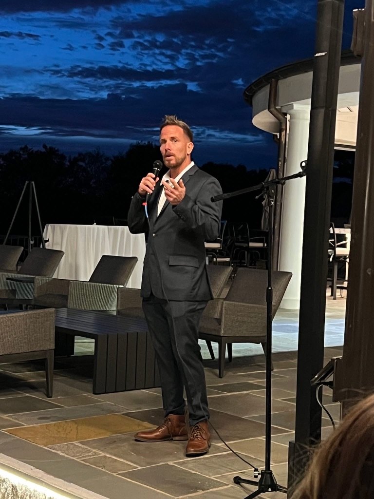 Seth Payne speaking on stage